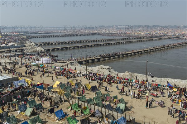 Many pontoon bridges crossing the river Ganges at the Kumbha Mela grounds