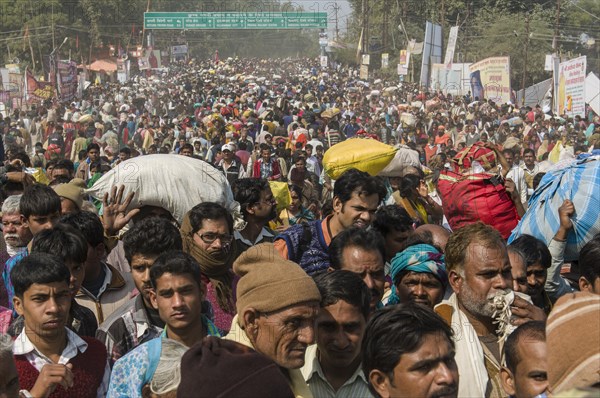 Crowds of people arriving at Kumbha Mela grounds