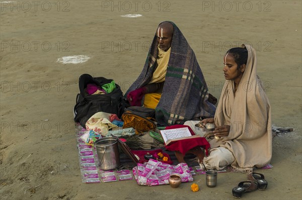 Priest and his daughter meditating