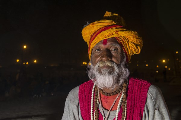 Portrait of a male pilgrim at night at the Sangam