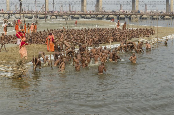 Taking a purifying bath as part of the initiation of new sadhus at the Sangam