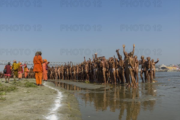 Group of new sadhus standing in the river Ganges