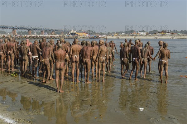 Group of new sadhus standing in the river Ganges