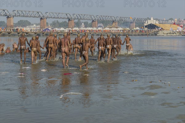 Taking a purifying bath in the river Ganges as part of the initiation of new sadhus