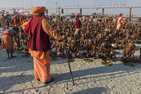 Taking their first meal in their new lives as part of the initiation of new sadhus at the Sangam