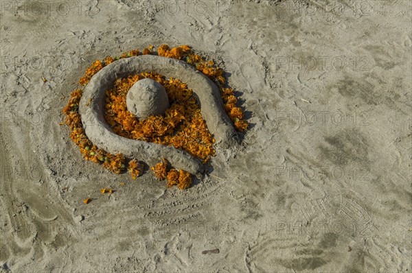 Shiva Lingam made of sand and flowers