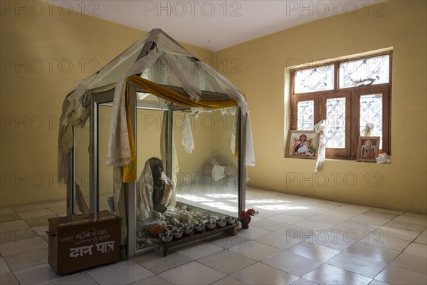 Mummy of a monk from 15th century in a glas container at a temple