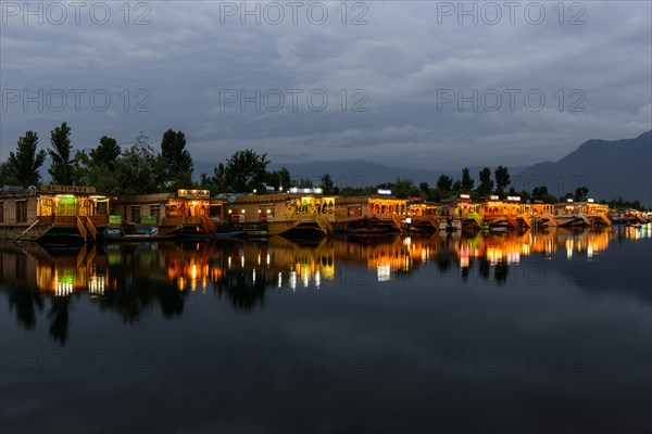 Houseboats on Dal Lake at night