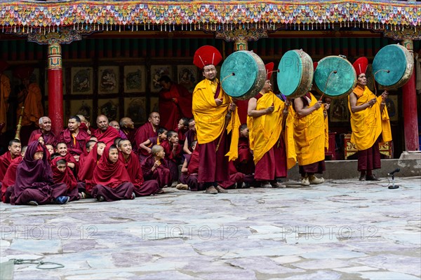 Monks making music as part of the opening ceremony of the Hemis Festival