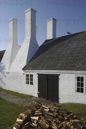 Four chimneys of a Bornholm herring smokehouse