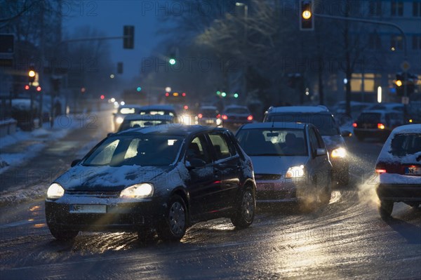 Road traffic in the city on a winter morning