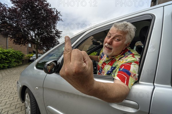 Car driver giving the finger