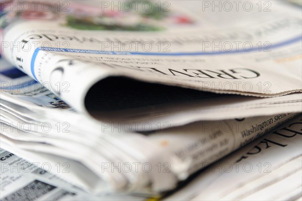 Folded newspapers