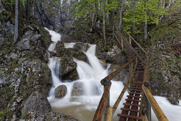 Wooden bridge and a waterfall in Baerenschuetzklamm gorge