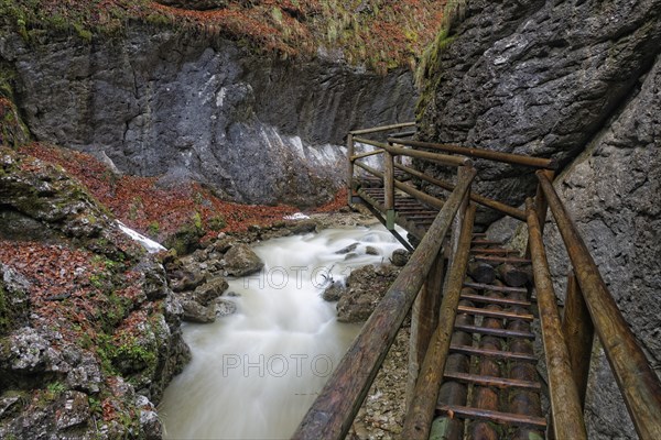 Wooden bridge and a waterfall in Baerenschuetzklamm gorge