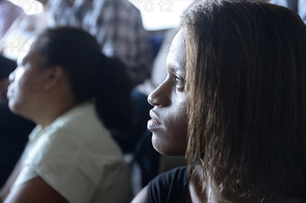 Young people during catechetical instruction in a slum or favela