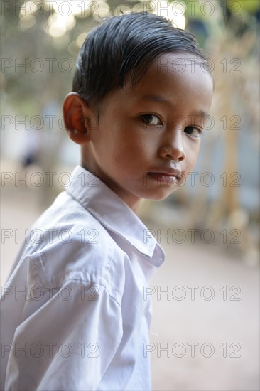 Schoolboy with his combed hair back