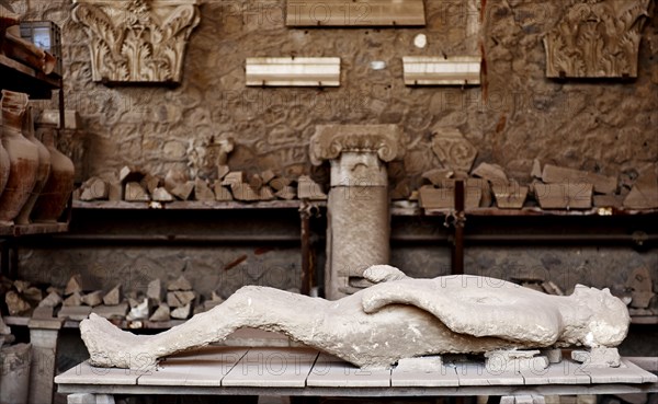 Plaster cast of a dying man