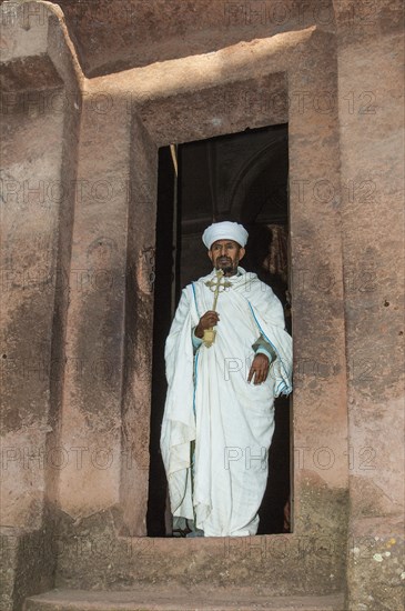 Priest holding a cross