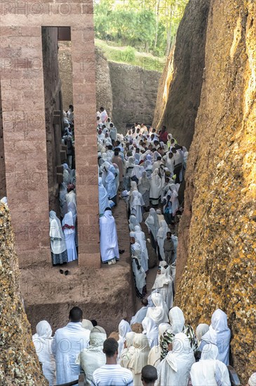 Pilgrims wearing a traditional white shawl attending a ceremony at the Bete Medhane Alem Church