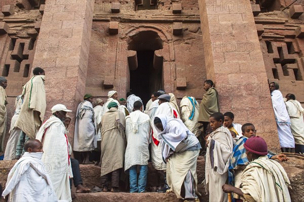 Pilgrims wearing a traditional white shawl attending a ceremony at the Bete Medhane Alem Church