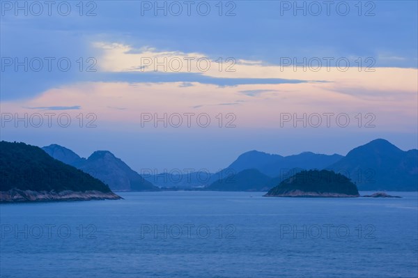 View from Copacabana over the ocean and the hills at sunset