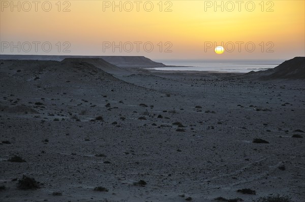 Sunset over the stone desert at the Rio de Oro Bay