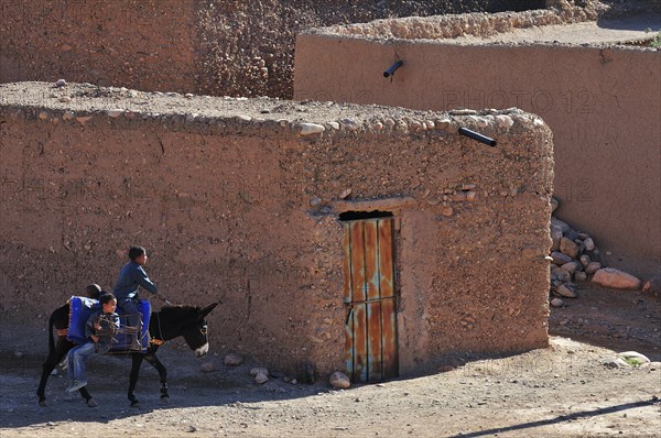 Donkey riders in the Kasbah Tamnougalt near Agdz