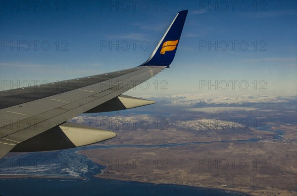 Wing of an airplane over Southern Iceland