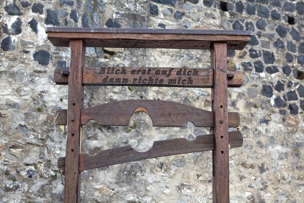 Pillory from the Middle Ages with the inscription 'Blick erst auf dich