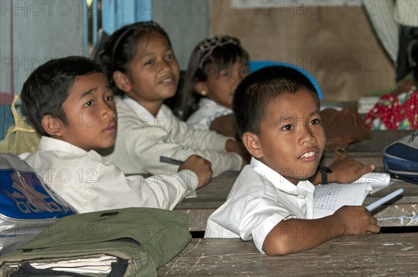 Elementary students wearing school uniforms in a school of Areyskat