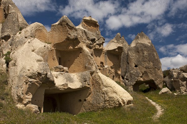 Heavily eroded tuff cones with the remains of storage spaces