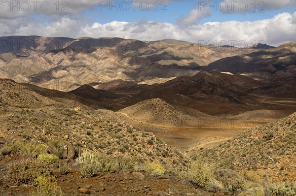 Light and shadows in a broad landscape with hills