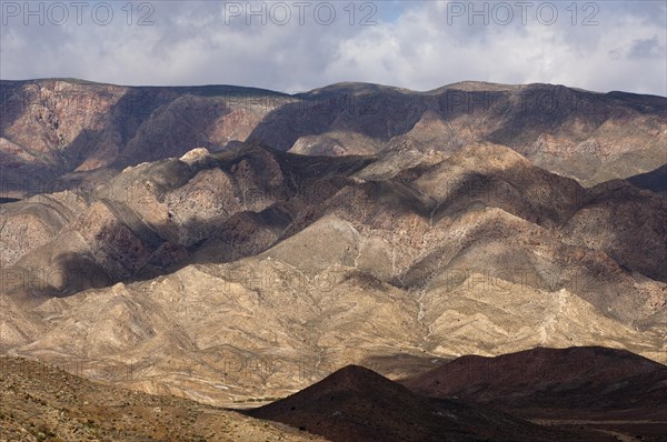 Light and shadows in a broad landscape with hills