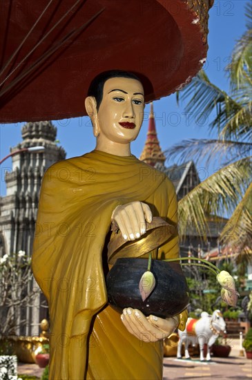 Statue of a mendicant monk at Wat Preah Prohm Rath temple