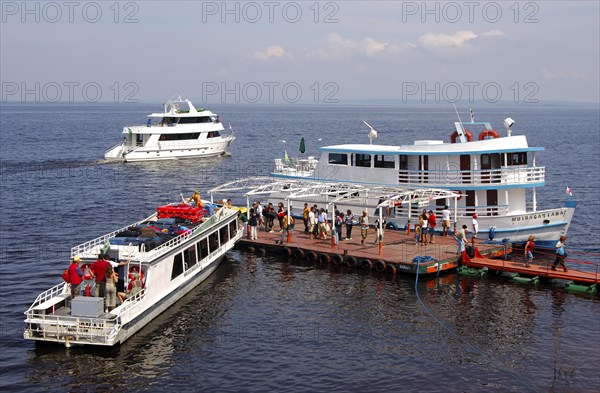 Motorboats at a dock on the Rio Negro river