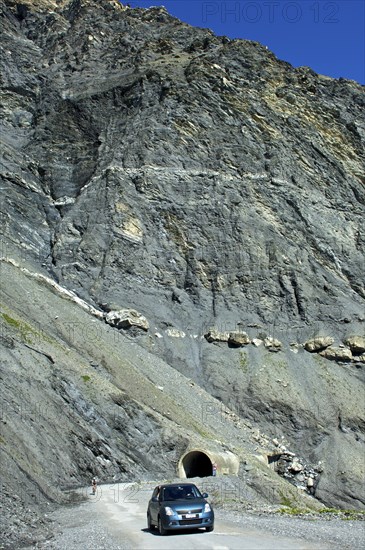 Car on Sanetsch Pass road with road tunnel