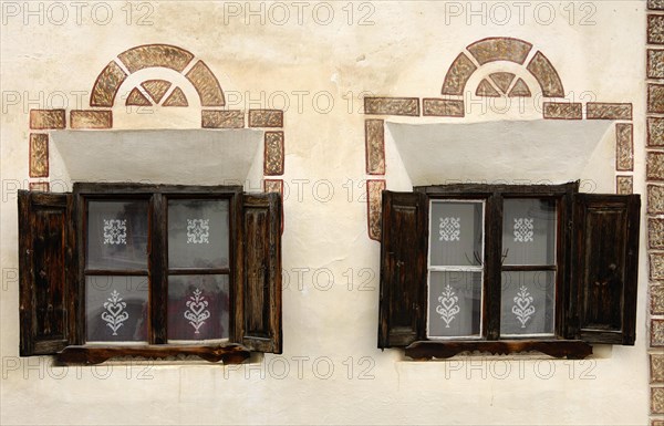 Windows of an Engadin house decorated with Sgraffito