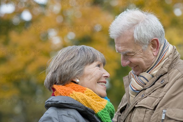 Senior couple smiling at each other