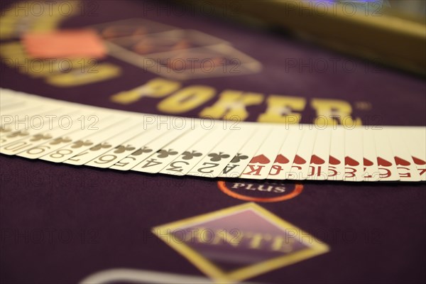 Poker table with deck of poker cards