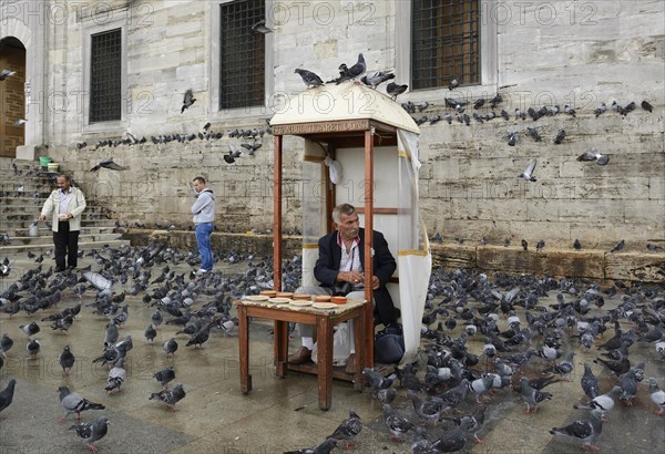 Man selling bird feed