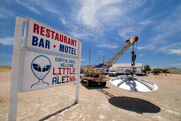 UFO hanging on the tow hook in the car park of the 'Little A'Le'Inn' pub