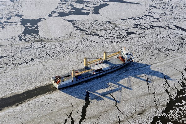 Ship on the Elbe River with ice flow