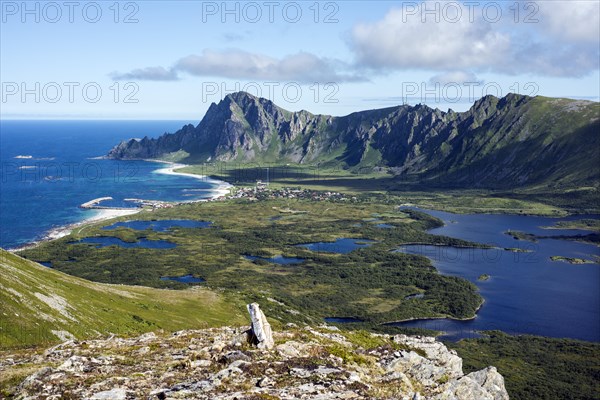Glacial moraine and the village of Bleik with ponds and lakes