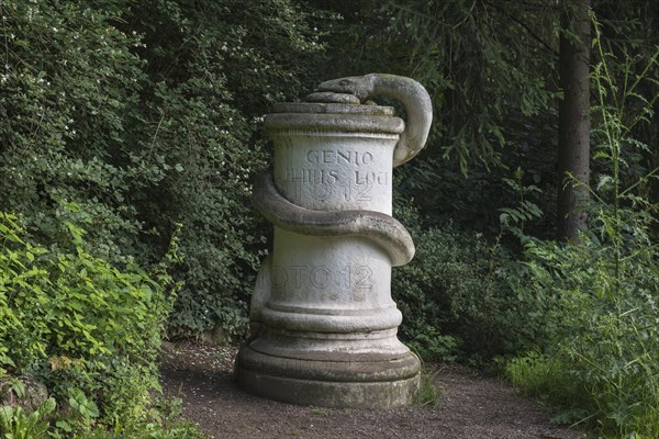 Snake's Stone in the park with the inscription 'Genio huius loci'