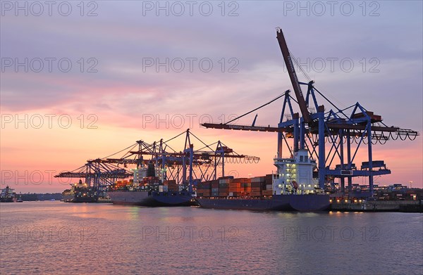 Container ships in the port at dusk