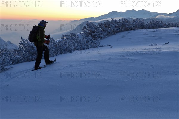 Man on a snowshoe tour on Torrener Joch pass