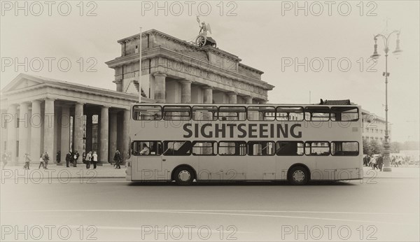 Sightseeing bus for a city tour in front of the Brandenburg Gate