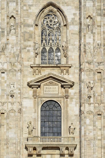 Window over the main portal of the west facade of Milan Cathedral or Duomo di Santa Maria Nascente