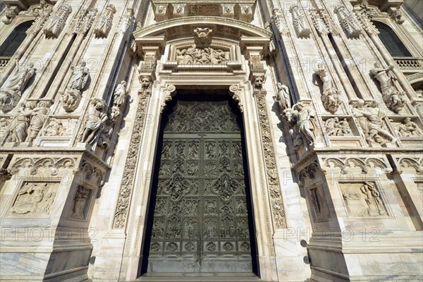 Bronze main door with scenes from the life of Mary